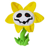 Flowey sunflower plush with yellow petals, a white grinning face, red pupils, and a green stem and leaves