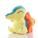 Cyndaquil Pokémon plush with a yellow body, teal back and orange flames, side view