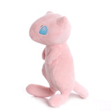 Side view of pink Mew plush with pointed ears, short arms, and a long tail