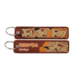 Front and back of the Eevee double-sided embroidered keychain with metal split ring