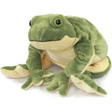 Green frog plush seated with a cream belly and chin, raised green-and-black eyes, long arms, and splayed toes
