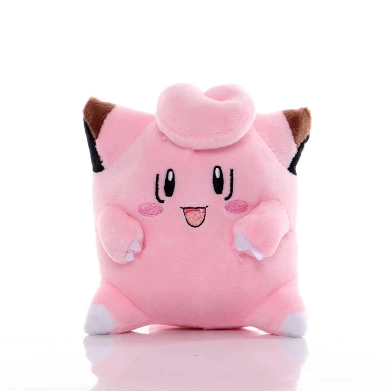 Pink Clefairy plush with a curled forehead tuft, brown-tipped ears, and embroidered smiling face