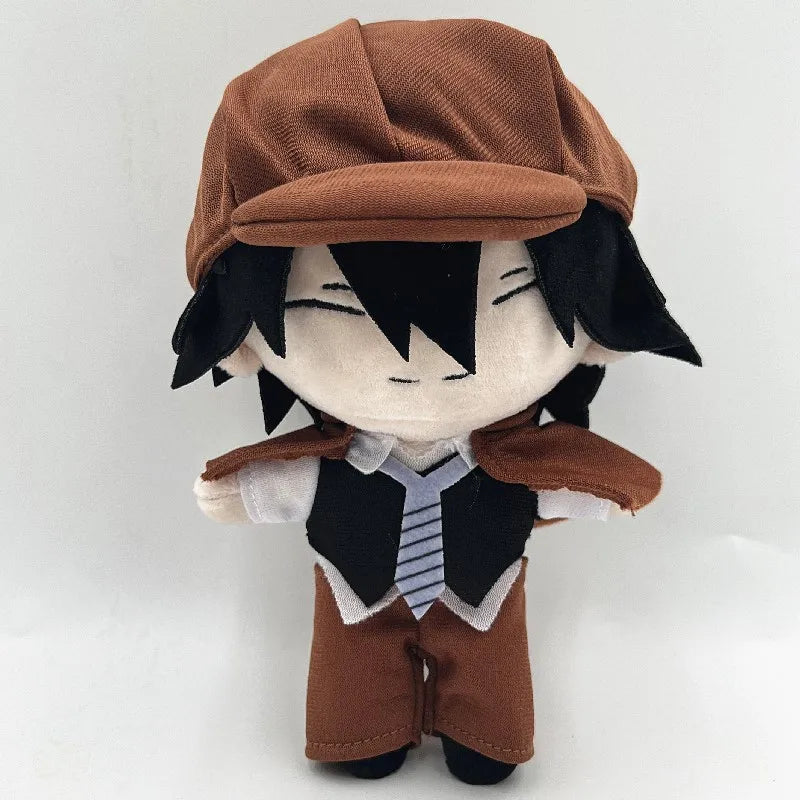 Ranpo Edogawa plush with black hair, closed smiling eyes and a brown cap and cape