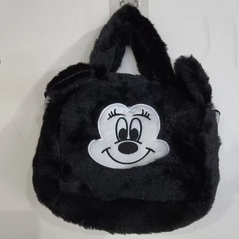 Black Minnie Mouse plush handbag with embroidered face, raised ears, and two handles