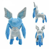 Standing pale blue Glaceon Pokémon plush with pointed ears, blue head ribbons, paws and tail, shown from three angles