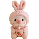 Front view of a pink pig plush in a long-eared bunny costume holding a strawberry cup on a white background