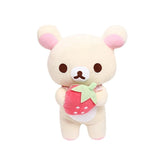 Cream-colored Korilakkuma plush holding a red strawberry