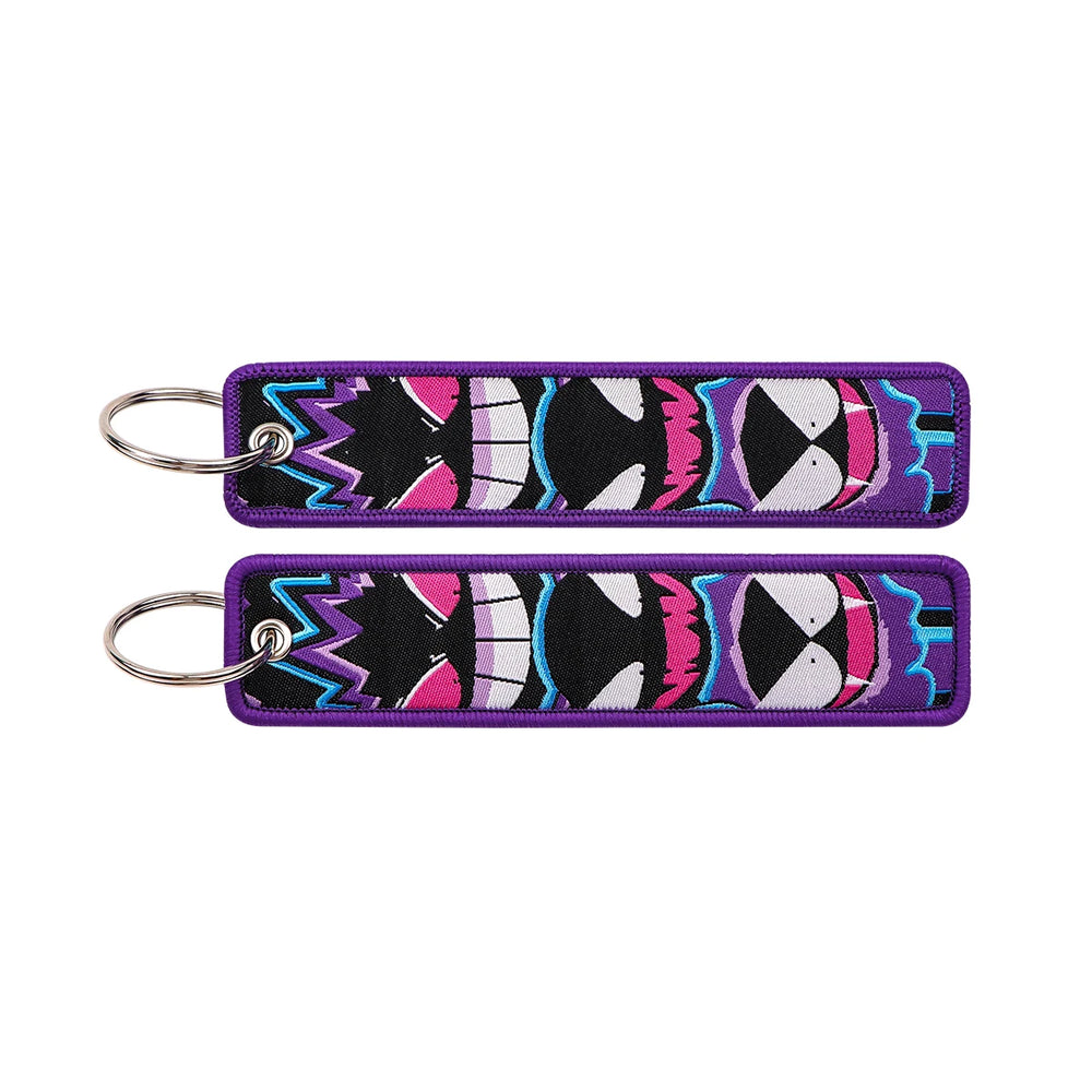 Front and back of the Gengar Evolution double-sided embroidered keychain with metal split ring