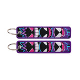 Front and back of the Gengar Evolution double-sided embroidered keychain with metal split ring