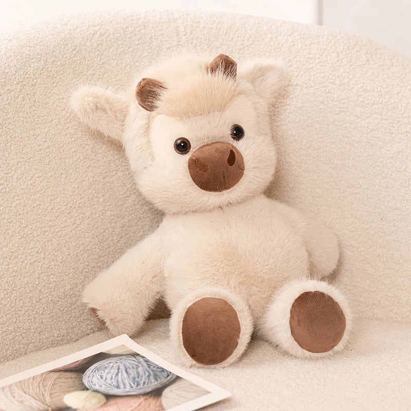 Cream Highland cow plush with a fluffy coat, brown horns, rounded muzzle, and brown hooves, 40 cm