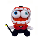 Caine plush with a toothy grin, blue and green eyes, red vest, black top hat, and cane