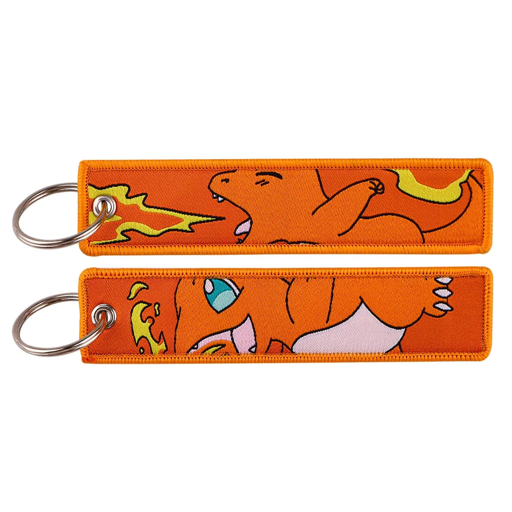 Front and back views of an orange Charmander embroidered Pokémon keychain