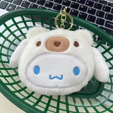 Cinnamoroll plush coin purse in a cream bear hood with blue embroidered face and gold-tone clip