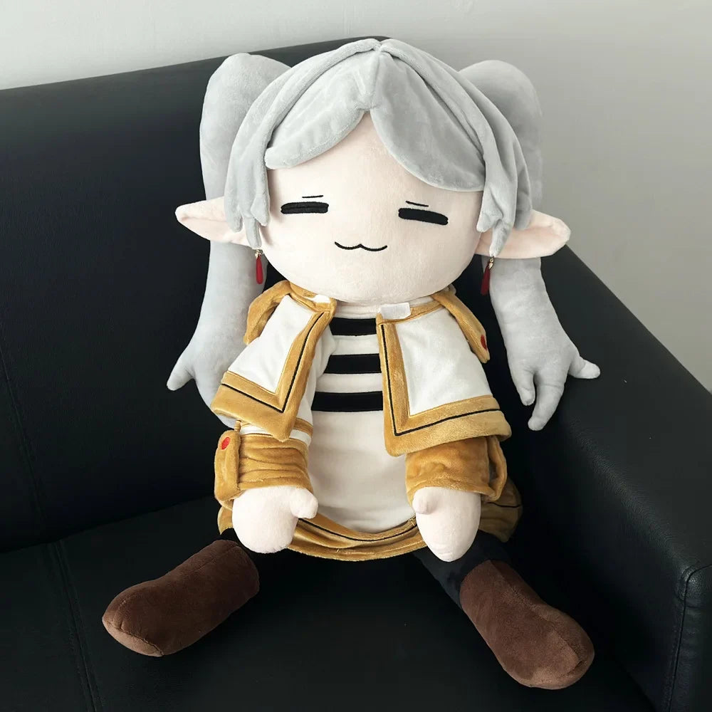 Frieren plush with silver hair, pointed ears and a white-and-gold outfit