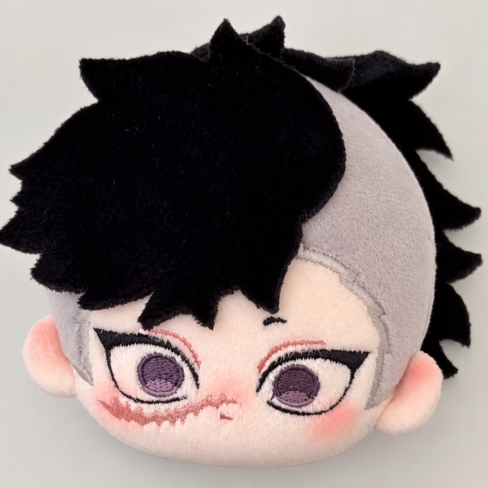 Close-up of Genya Shinazugawa plush face, scar and black-and-gray hair
