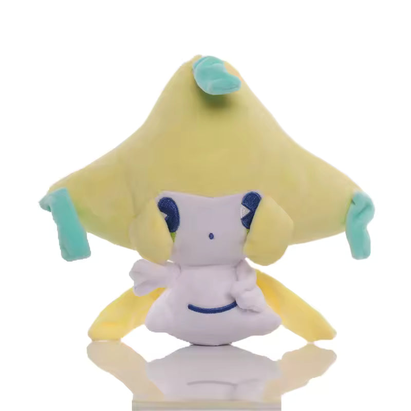 Jirachi character plush with yellow star-shaped head and teal accents on a white background