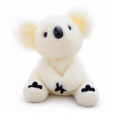 White koala plush with fluffy ears, a black oval nose, dark eyes, and black paw details