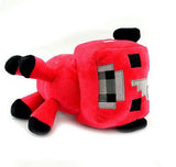 Red Minecraft cow plush lying on its side with square face and black hooves