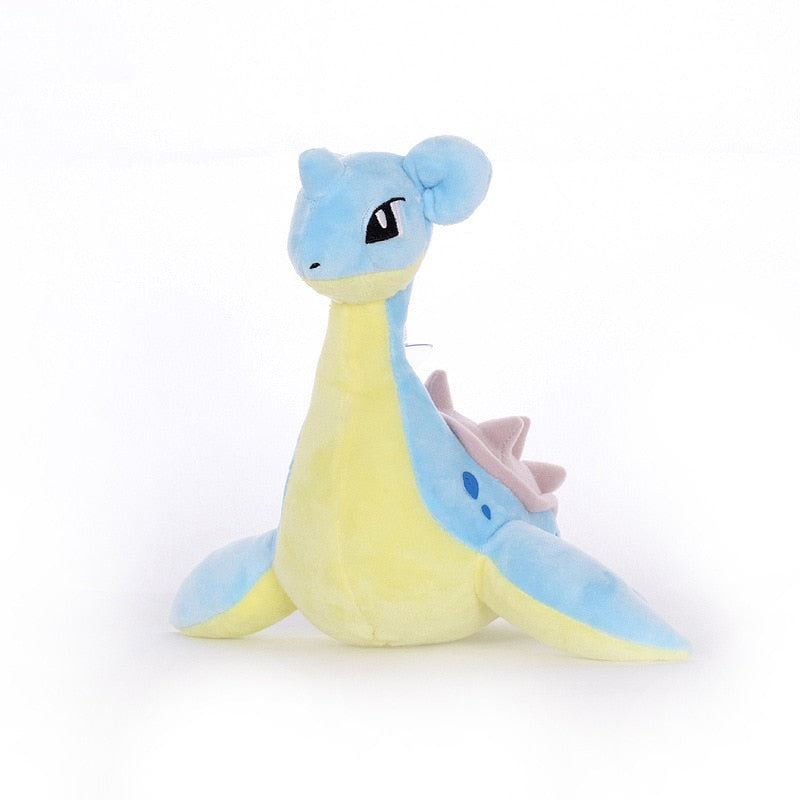 Front view of blue Lapras Pokémon plush with a pale yellow belly, broad flippers and pink spiked shell