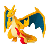 Mega Charizard Y plush with broad wings and red and yellow tail flame, angled view