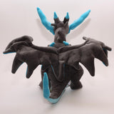 Mega Charizard X plush shown from behind with dark wings and blue tail