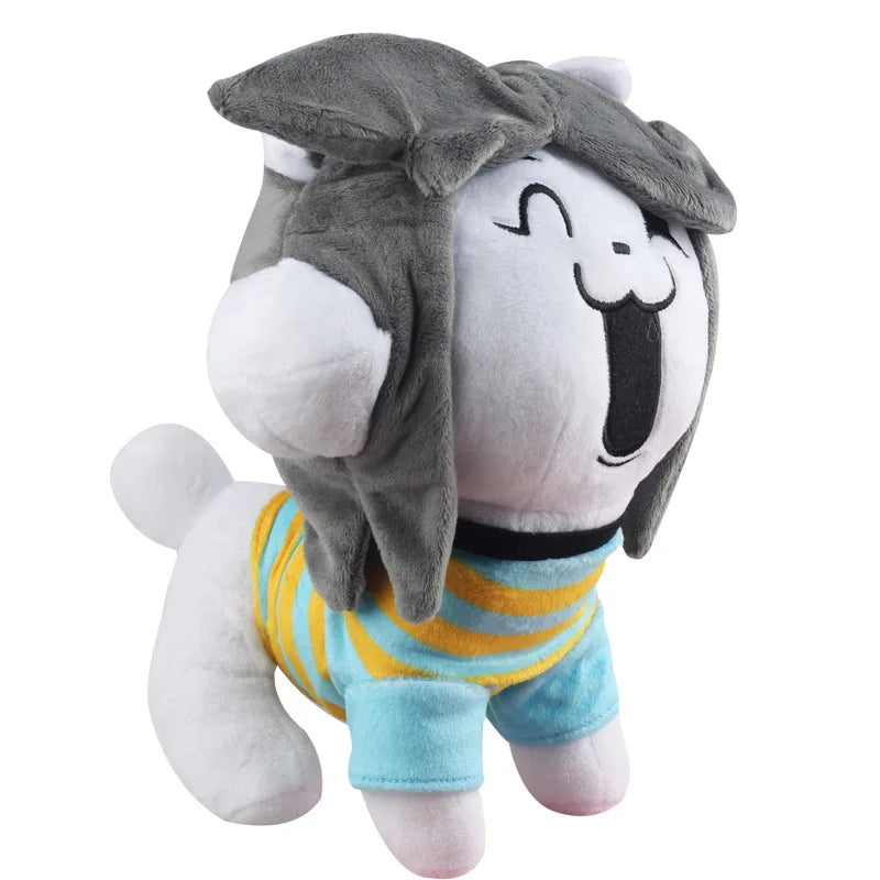 Temmie Undertale plush, 25 cm, with gray hair, smiling white face, blue-and-yellow stripes, and white paws
