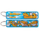 Dragonite Pokémon embroidered keychain — front and back of one blue-bordered tag