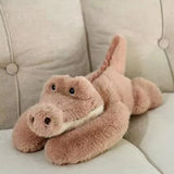 Dusty pink long-arm crocodile plush with a broad snout, small eyes, and a cream-colored chin, 30 cm