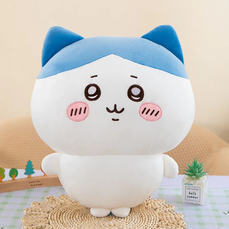Hachiware plush from Chiikawa with a blue-and-white head, pointed blue ears, pink cheeks, and small feet, 16–18 cm