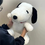 Snoopy plush with black floppy ears and red collar — 27 cm