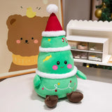 Green Christmas tree plush with a red Santa hat, smiling face, and embroidered ornament details