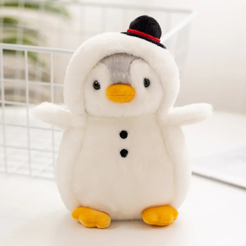 Penguin plush in a white snowman costume with a black top hat and yellow feet