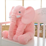 Pink elephant plush with large ears, long trunk, and white tusks