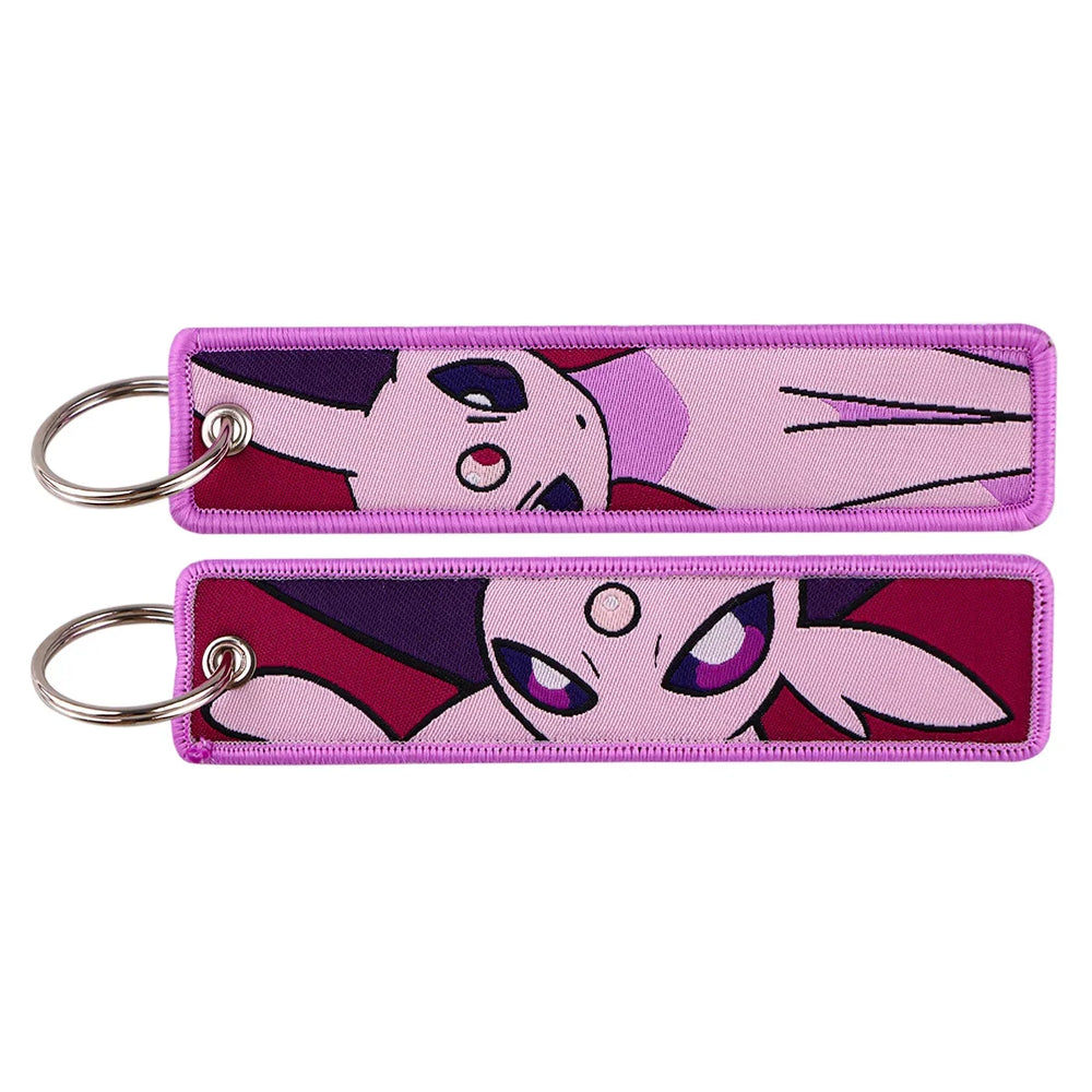 Front and back views of an Espeon embroidered Pokémon keychain