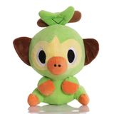 Green Grookey plush with brown ears, pale yellow face, orange muzzle and paws, and a leaf-shaped tuft