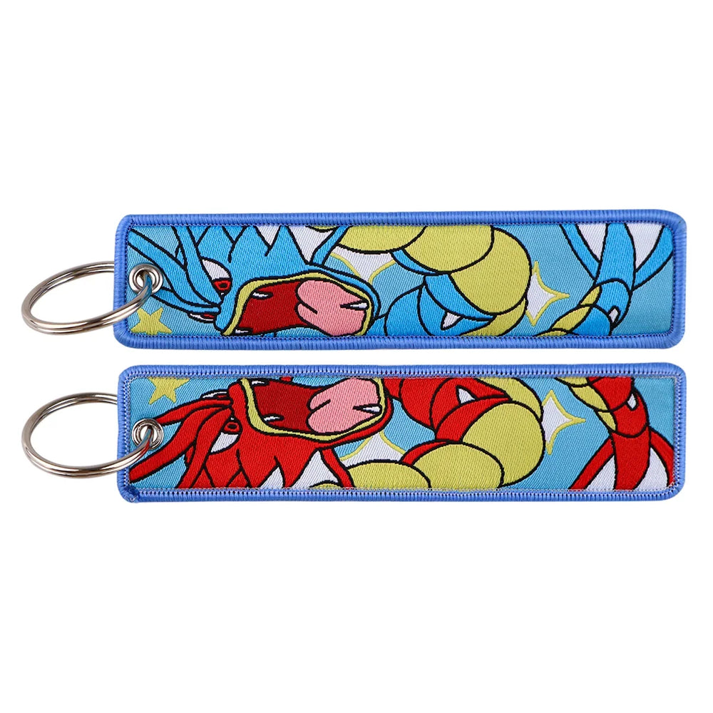 Front and back views of a Gyarados embroidered keychain with blue and red designs