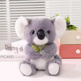 Gray koala plush with large white ears and a green leaf around its neck, 22 cm