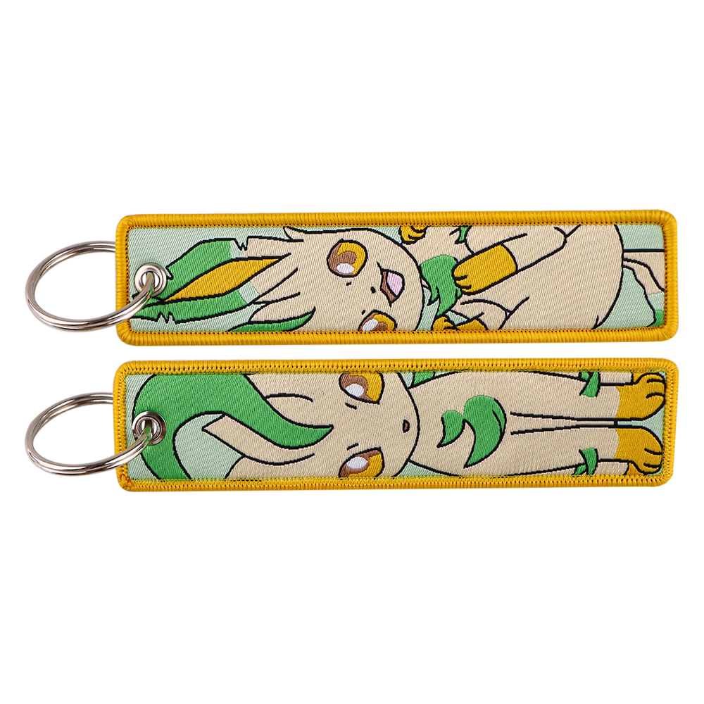 Front and back views of one cream and green Leafeon Pokémon embroidered keychain