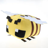 Blocky yellow Minecraft bee plush with brown stripes, pixel eyes, black antennae and white wings