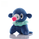 Popplio plush with pink nose, mint frill and navy-blue flippers