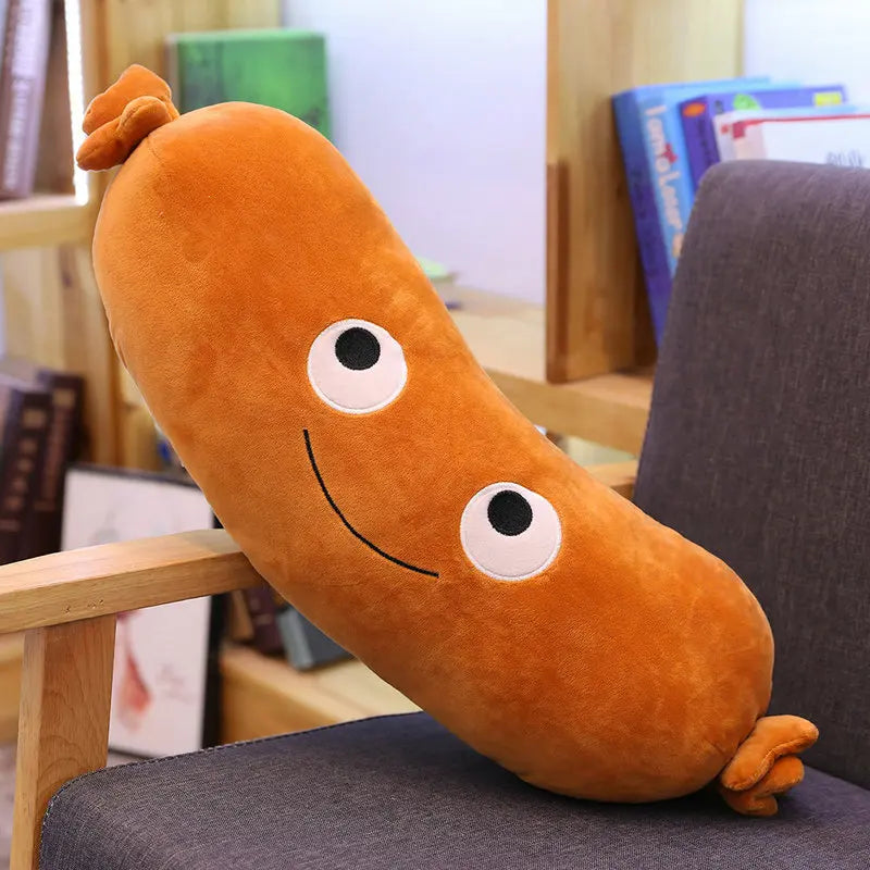 Orange smiling sausage plush with large white eyes and tied ends