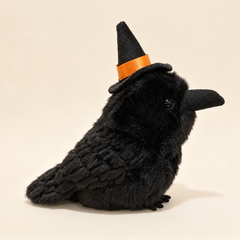 Black crow plush with textured feathers and a pointed witch hat with an orange ribbon, 20 cm