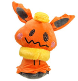 Mimikyu Flareon cosplay plush with orange ears, a yellow neck ruff and tuft, pink cheeks, and a wavy smile