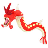 Red Shiny Gyarados Pokémon plush with open mouth, curled whiskers, yellow markings, and cream belly